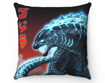 May include: Square throw pillow featuring a detailed illustration of Godzilla with glowing blue accents against a dark background. The Japanese text "ゴジラ" is printed in red. The pillow is a decorative item.