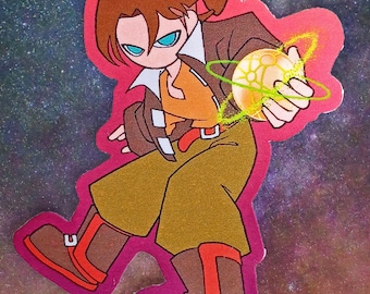 May include: A die-cut sticker featuring a cartoon character with brown hair and blue eyes, wearing a brown jacket, orange shirt, and olive pants. The character holds a glowing yellow orb with a ringed energy effect, outlined in a bright pink border.