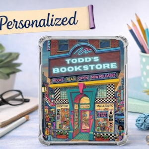 May include: Clear phone case featuring a colorful illustration of "Todd's Bookstore." The design includes the text "Books Read Open New Releases" and "Fiction Magazines." A banner above reads "Personalized."
