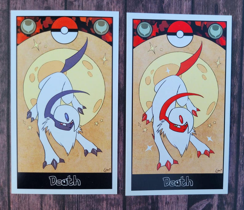 May include: Two cards with a white background and black borders. Each card features a stylized illustration of a white creature with a red or purple horn. The creature is standing on a yellow moon with stars. The text "Death" is printed at the bottom of each card.