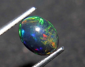 RARE !! OPALE NOIRE ET MULTICOLORE D'ETHIOPIE : 9.3 mm x 5.2