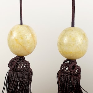 Pair of Chinese light yellow stone scroll weights