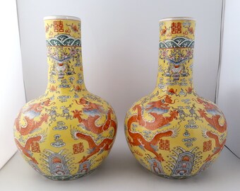 A pair of Chinese porcelain dragon tianqiupings