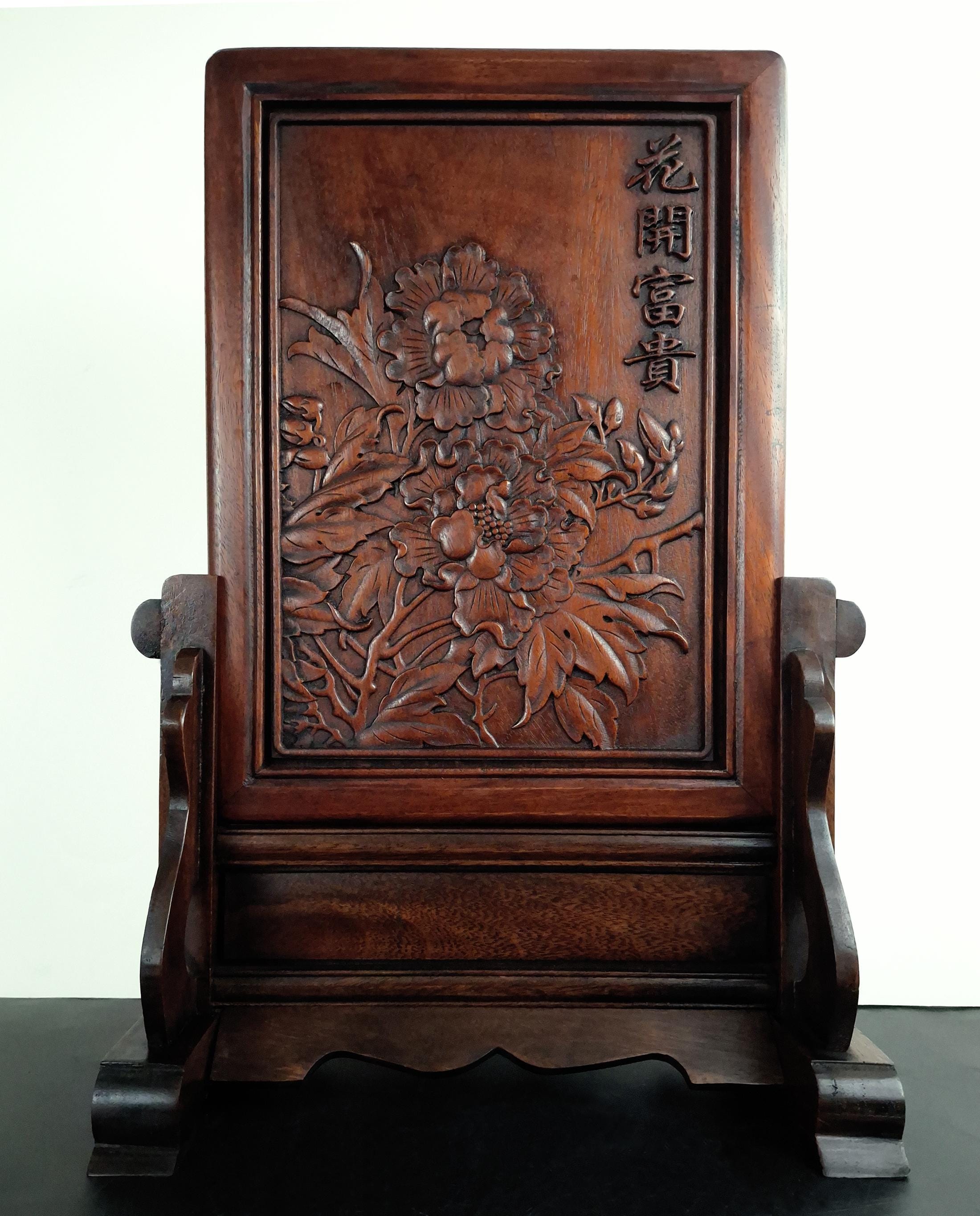 A Chinese carved and pierced huanghuali 