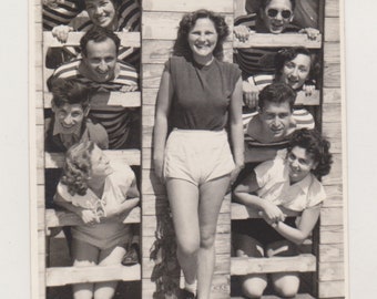 Smiling Young Woman and Her Quirky Companions Peeking Out from Behind Her Unusual Abstract Snapshot Original Vernacular Found Old Photo