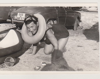 Elderly Lady in a Swimsuit Strikes Playful Poses with a Life Ring Abstract Snapshot Original Vernacular Found Photo