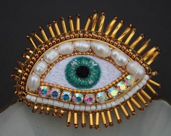 Hand embroidered Eye brooch with freshwater pearls, brown blue green purple colors