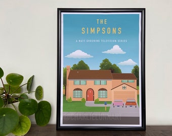 May include: A framed print of the Simpsons house with a blue sky and white clouds. The text "The Simpsons" is in yellow letters and the text "A Matt Groening Television Series" is in black letters. The house is a light orange color with a brown roof and a red door. There are two cars parked in the driveway, one pink and one red.