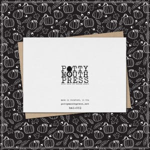 May include: A white greeting card with black text reading POTTY MOUTH PRESS, awful cards for awesome people, made in rockford, IL USA, pottymouthpress.net, and hal-003, resting on a black background with a white line drawing pattern of pumpkins.