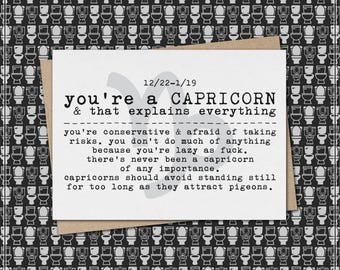 May include: A greeting card with the text "you're a CAPRICORN & that explains everything" on a white background. The card is set against a black and white toilet pattern.