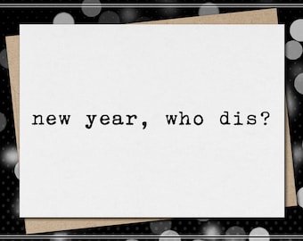 May include: A greeting card with the text "new year, who dis?" in a typewriter font. The card is white, layered over a brown envelope, and set against a black and white polka dot background.