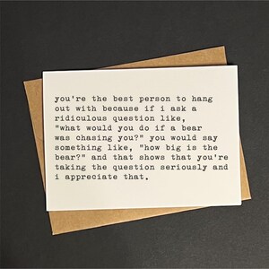 May include: A white card with black text, placed on a brown envelope, against a dark background. The text reads: "you're the best person to hang out with because if I ask a ridiculous question..." A thoughtful gift.