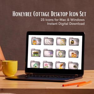 May include: A laptop displays a Honeybee Cottage Desktop Icon Set. The screen shows 12 gray folder icons with watercolor illustrations of bees, honey, flowers, and a beehive. A yellow mug and orange pens sit on the wooden desk.