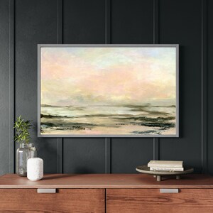 Abstract coastal landscape print with soft sunset horizon in a wood frame