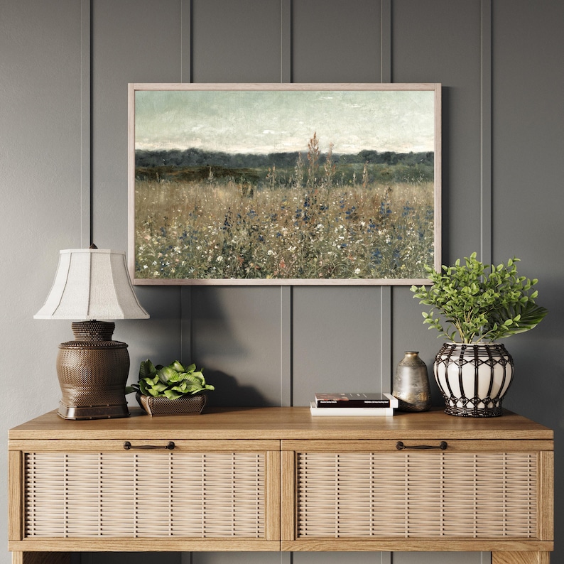 Framed wildflower meadow wood wall sign displayed above a wooden console table