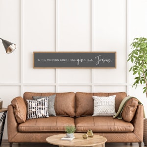 May include: A wooden framed sign with a gray background and white text that reads "In the morning when I rise, give me Jesus."