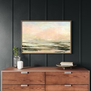 Framed abstract coastal wall art featuring calm sunset tones