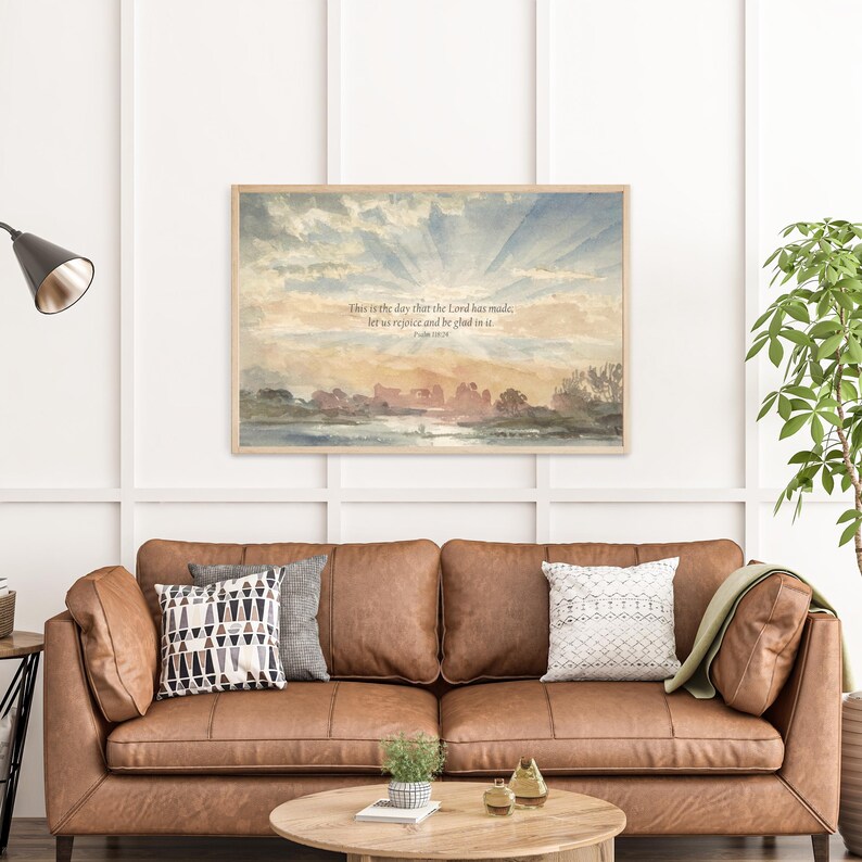 Close-up of vintage watercolor sunset artwork with Psalm 118:24 scripture text