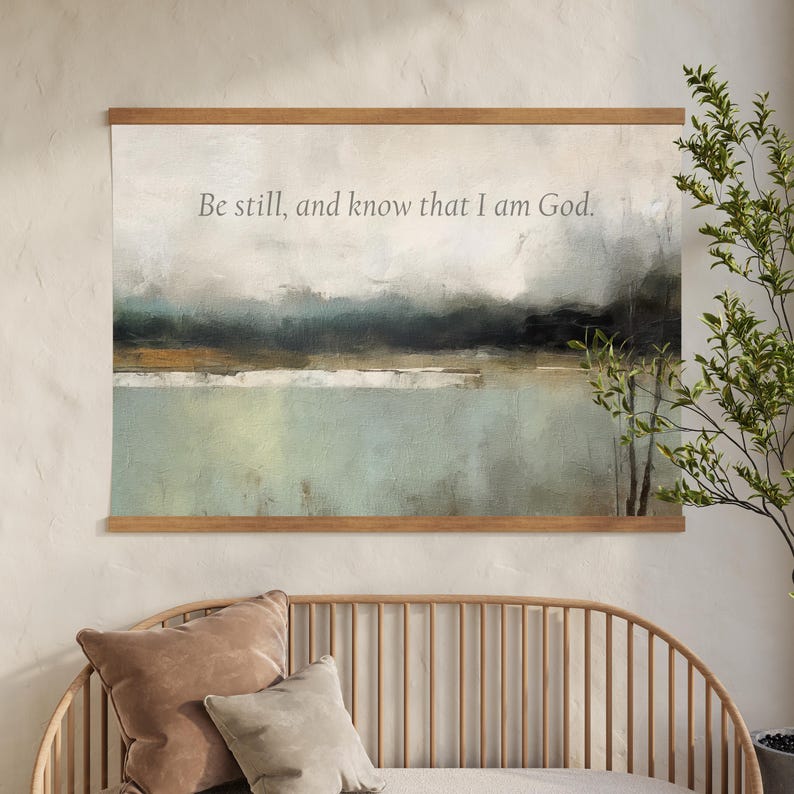 Neutral abstract scripture canvas tapestry wall art displaying Be Still and Know in a minimalist, faith-inspired design.