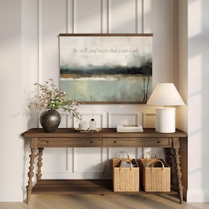 Be Still and Know abstract canvas tapestry wall hanging in soft muted tones, featuring minimalist Christian scripture wall art.