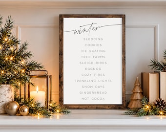 May include: A rectangular wooden sign with a dark brown frame featuring the word winter in black script at the top, followed by a list of words including sledding, cookies, ice skating, tree farms, sleigh rides, eggnog, cozy fires, and hot cocoa.