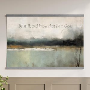 Faith-based abstract canvas tapestry wall hanging with Be Still and Know text, styled as large Christian wall decor.