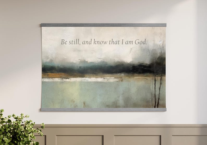 Faith-based abstract canvas tapestry wall hanging with Be Still and Know text, styled as large Christian wall decor.