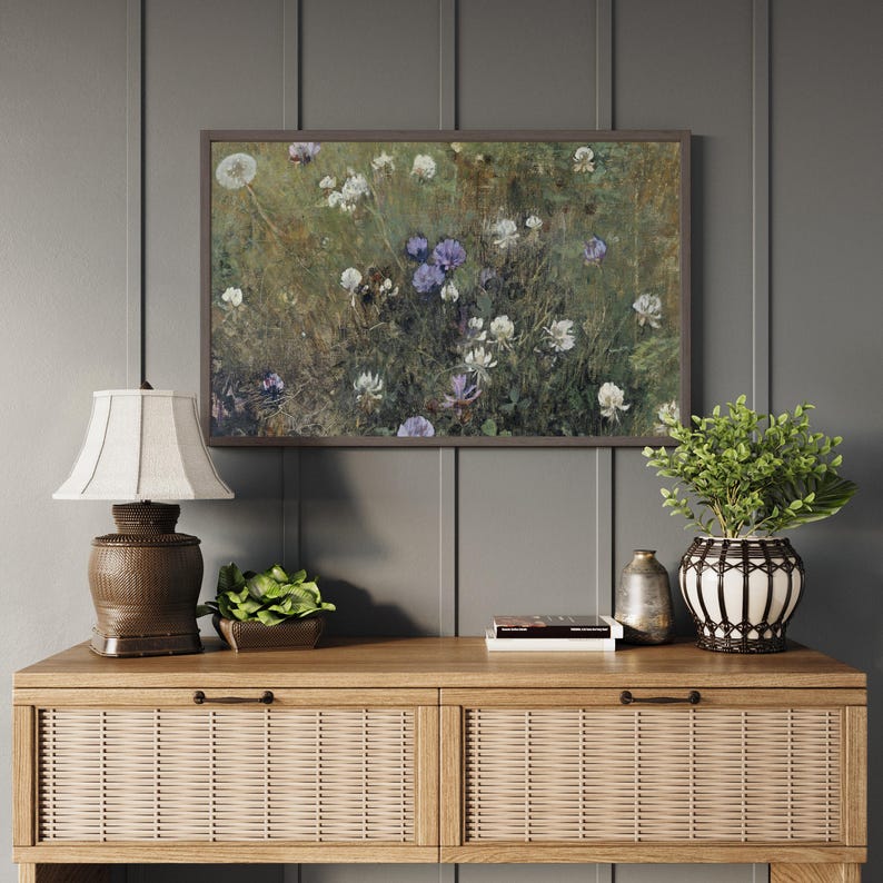 Framed floral meadow artwork in natural wood frame