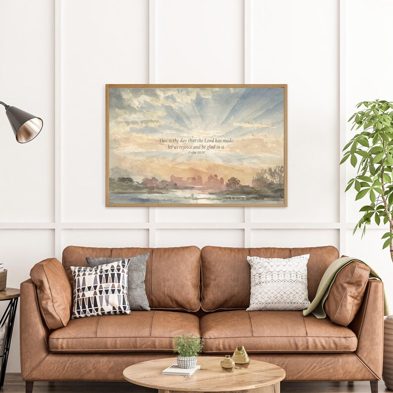 Framed Psalm 118:24 Bible verse wall art displayed in a warm living room with vintage decor