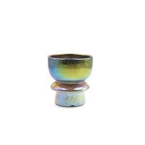 May include: A iridescent green and blue ceramic planter with a wide base and a flared top.