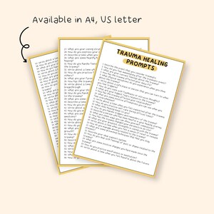 May include: A close-up of three pages of printable journaling prompts for trauma healing. The pages are yellow with black text and a light brown border. The text on the top page reads "Trauma Healing Prompts".