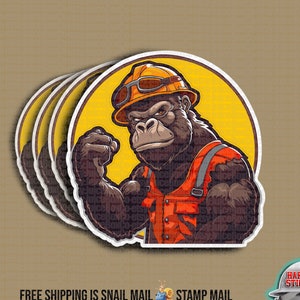 May include: A set of four stickers featuring a cartoon gorilla wearing a hard hat and safety glasses. The gorilla is wearing a bright orange vest and has a determined expression on its face. The stickers are printed on white, glossy paper and have a rounded shape.