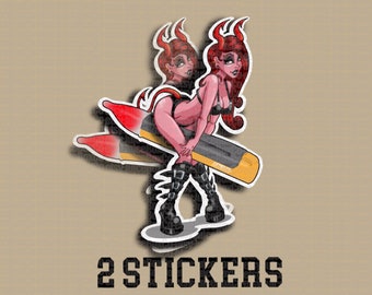 May include: Two red and black devil stickers with a woman holding a yellow and black object. The text "2 STICKERS" is below the stickers.