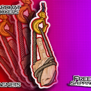 May include: A sticker or magnet design featuring a hand giving the middle finger, wrapped in rope, and suspended from a crane hook. The design includes the text "HARDHAT STICKERS" and "MAGNETS". The background transitions from red to purple.