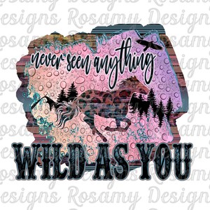May include: A digital illustration of a horse running through a forest with a pink and blue watercolor background. The text "never seen anything WILD-AS-YOU" is written on the image. The image is a design by Rosamy Designs Original.