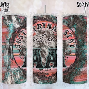 May include: A sublimation design for a tumbler featuring a distressed, circular graphic with the text "Just Tryna Stay Out of AA" in black and white lettering on a pink, blue, and white background.