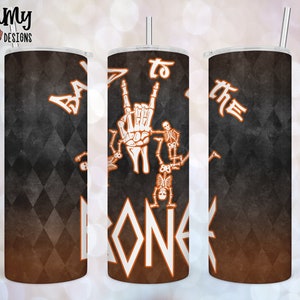 May include: A black and orange tumbler with a white design that says "Back to the Bone" with a skeleton hand making the rock and roll sign.