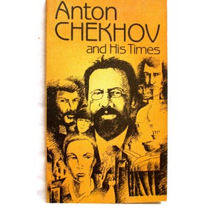 May include: A yellow book cover with the title "Anton Chekhov and His Times" in black text. The cover features a black and white illustration of Anton Chekhov and other people.