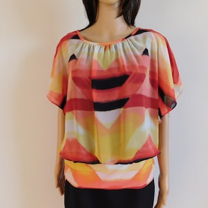 Abstract summer blouse-soft chiffon like sheer material with black lining-peplum at bottom-Small-colors of sunset-80&#39;s vintage-