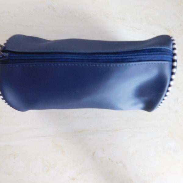 Great travel cosmetic bag-Estee Lauder-new-never used-cylinder shape so it fits easily with rolled clothing-navy blue-washable-zippered top