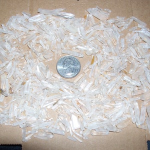 1/8 pounds lbs of small Quartz crystals per lot. About 200 to 250 crystals per lot.
