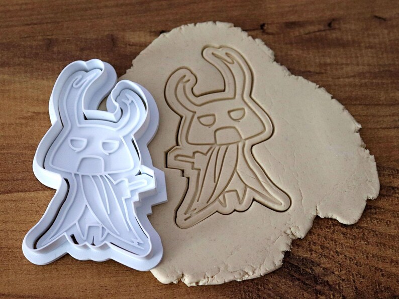 May include: A set of three ceramic mugs with a speckled, matte finish. The mugs are in shades of cream, light gray, and dark gray. Each mug has a simple, minimalist design, perfect for coffee or tea.