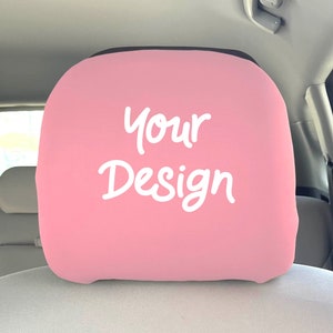 May include: Pink car seat headrest cover with the text "Your Design" in white.