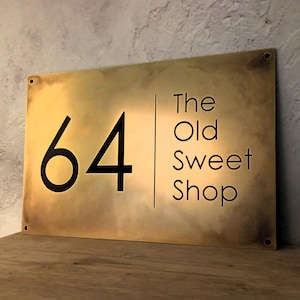 Antique brass metal business sign, made from solid brass with aged patina finish