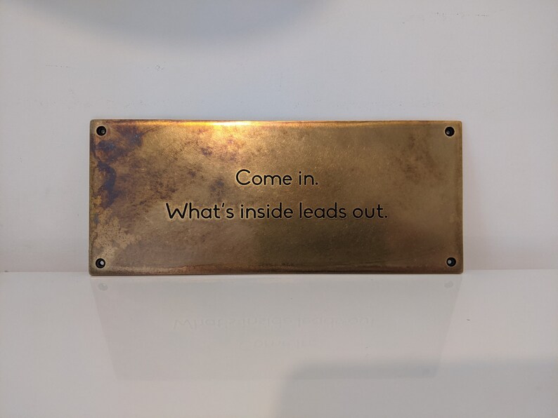 Aged brass plaque with custom text and patina finish