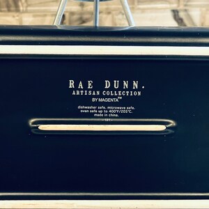 May include: Black Rae Dunn Artisan Collection by Magenta dish with white lettering. Dishwasher, microwave, and oven safe up to 400 degrees Fahrenheit or 205 degrees Celsius. Made in China.