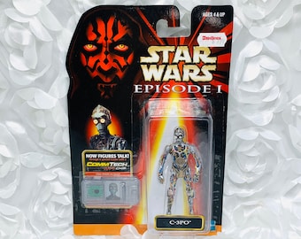 May include: A Star Wars Episode I action figure of C-3PO in a plastic blister pack. The figure is silver and gold with a detailed design. The packaging features a red and black image of Darth Maul.