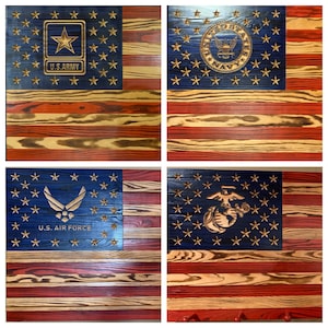 May include: Four wooden American flags, each with a different branch of the military emblem. The flags are all distressed and have a rustic look. The emblems are "U.S. Army", "U.S. Navy", "U.S. Air Force", and "U.S. Marine Corps".