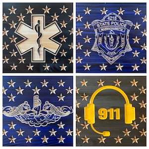 May include: Four wooden plaques with a blue and black background and gold stars. Each plaque features a different symbol: a medical star of life, a police badge with the text "4218 STATE POLICE MASSACHUSETTS DEPT STATE POLICE", a submarine with two fish, and a yellow headset with the text "911".