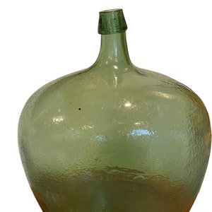 antique demi-john blown dark green bottle in good condition.